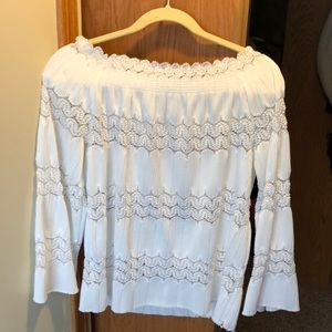 White off the shoulder shirt.